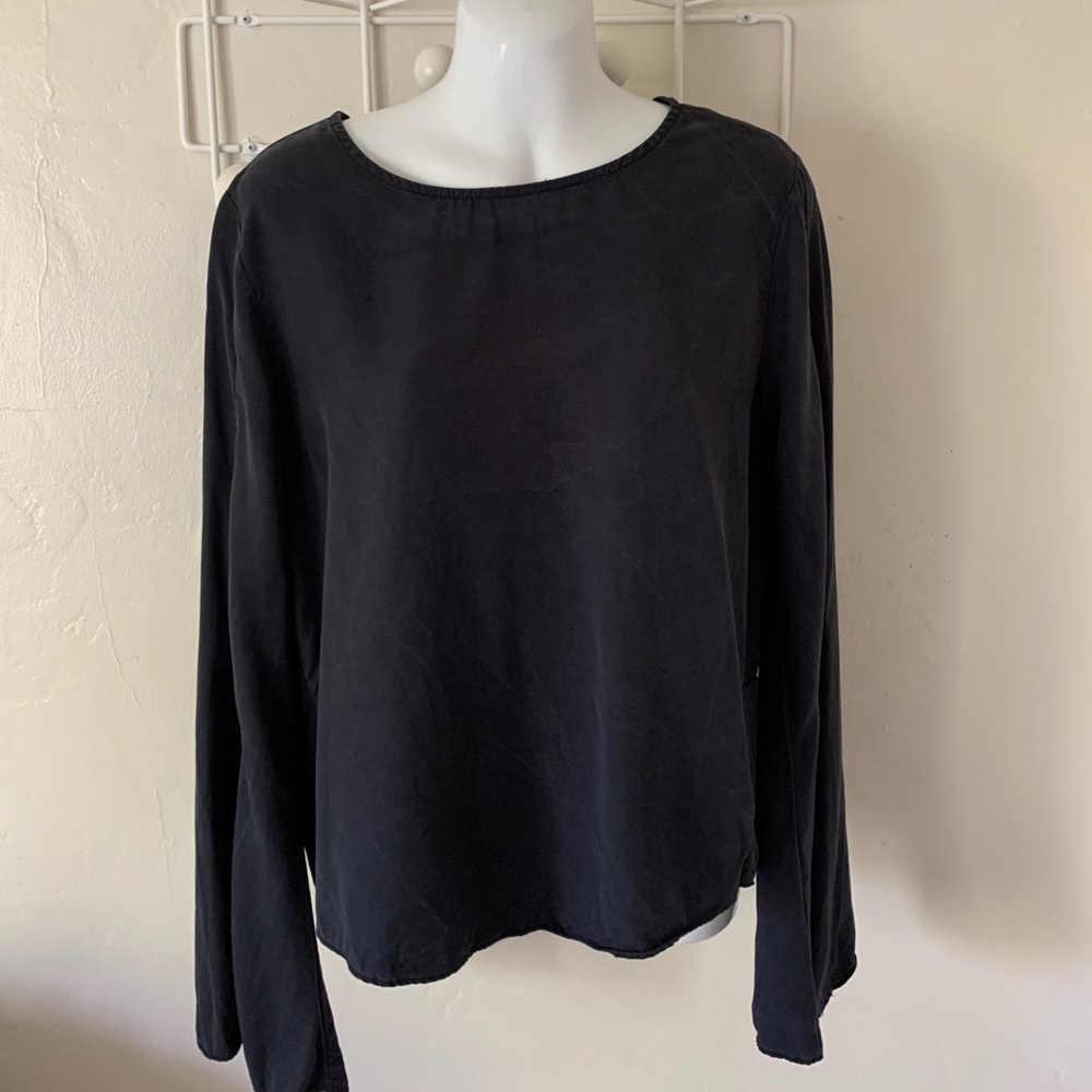 Farrow blouse with long sleeve bells slits.